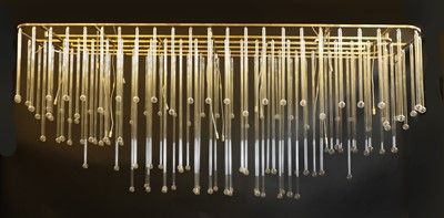 Lot 490 - An impressive brass-framed baguette chandelier
