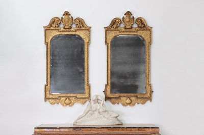 Lot 184 - A pair of George II gilt gesso pier mirrors