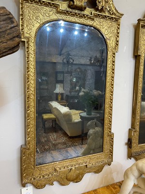 Lot 184 - A pair of George II gilt gesso pier mirrors