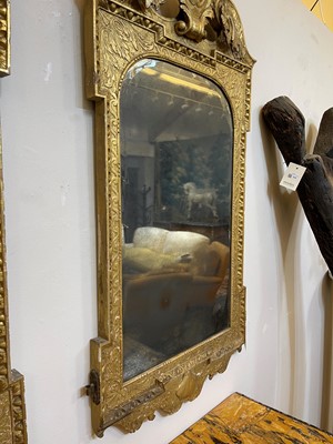 Lot 184 - A pair of George II gilt gesso pier mirrors