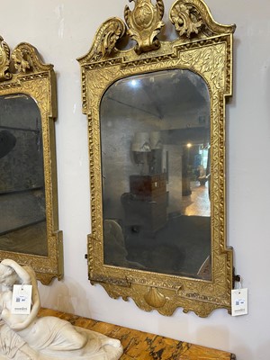 Lot 184 - A pair of George II gilt gesso pier mirrors