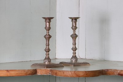 Lot 320 - A pair of George III silver taper sticks