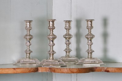 Lot 321 - A pair of cast silver candlesticks in the 18th century-style