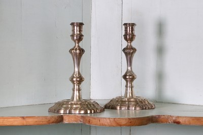 Lot 319 - A pair of George II cast silver candlesticks