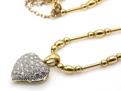 Lot 396 - An 18ct yellow and white gold diamond set heart shaped necklace, by David Morris, c.1995