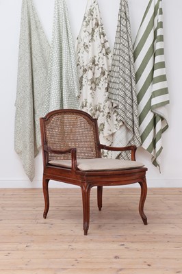 Lot 150 - A Louis XV-style walnut bergère fauteuil