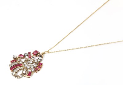 Lot 192 - A calibre ruby, synthetic ruby and diamond scroll pendant, c.1935