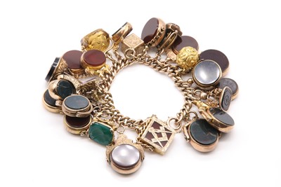 Lot 85 - A curb link charm bracelet