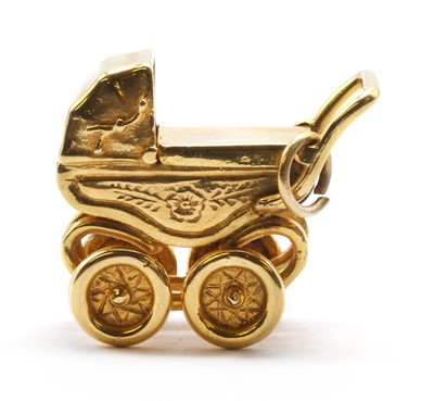 Lot 403 - A 9ct gold pram charm