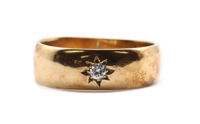 Lot 100 - An 18ct gold diamond set band ring