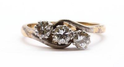 Lot 53 - A gold three stone diamond ring