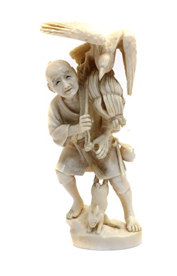 Lot 141 - A Japanese ivory okimono