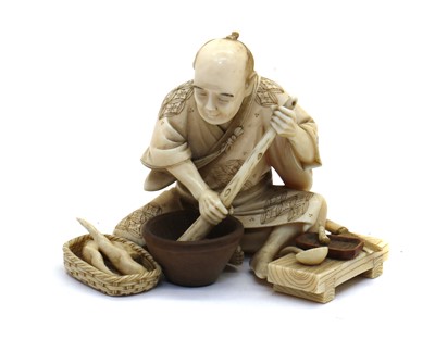 Lot 136 - A Japanese ivory okimono