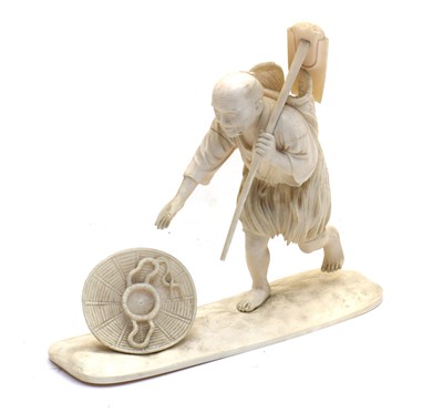 Lot 133 - A Japanese ivory okimono