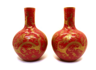 Lot 133 - A pair of Chinese red-glazed tianqiuping