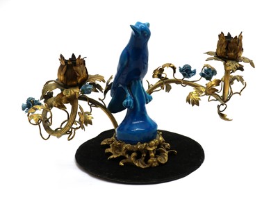 Lot 178 - An earthenware and gilt metal candelabra