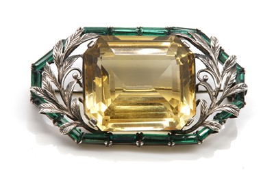Lot 146 - An Arts & Crafts silver citrine and paste brooch, attributed to Bernard Instone