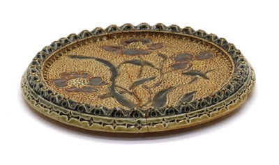 Lot 159 - A Victorian glazed stoneware teapot stand by the Martin Brothers