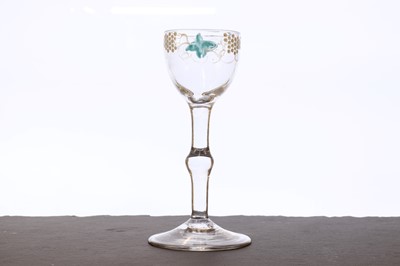Lot 341 - A Beilby polychrome enamelled wine glass