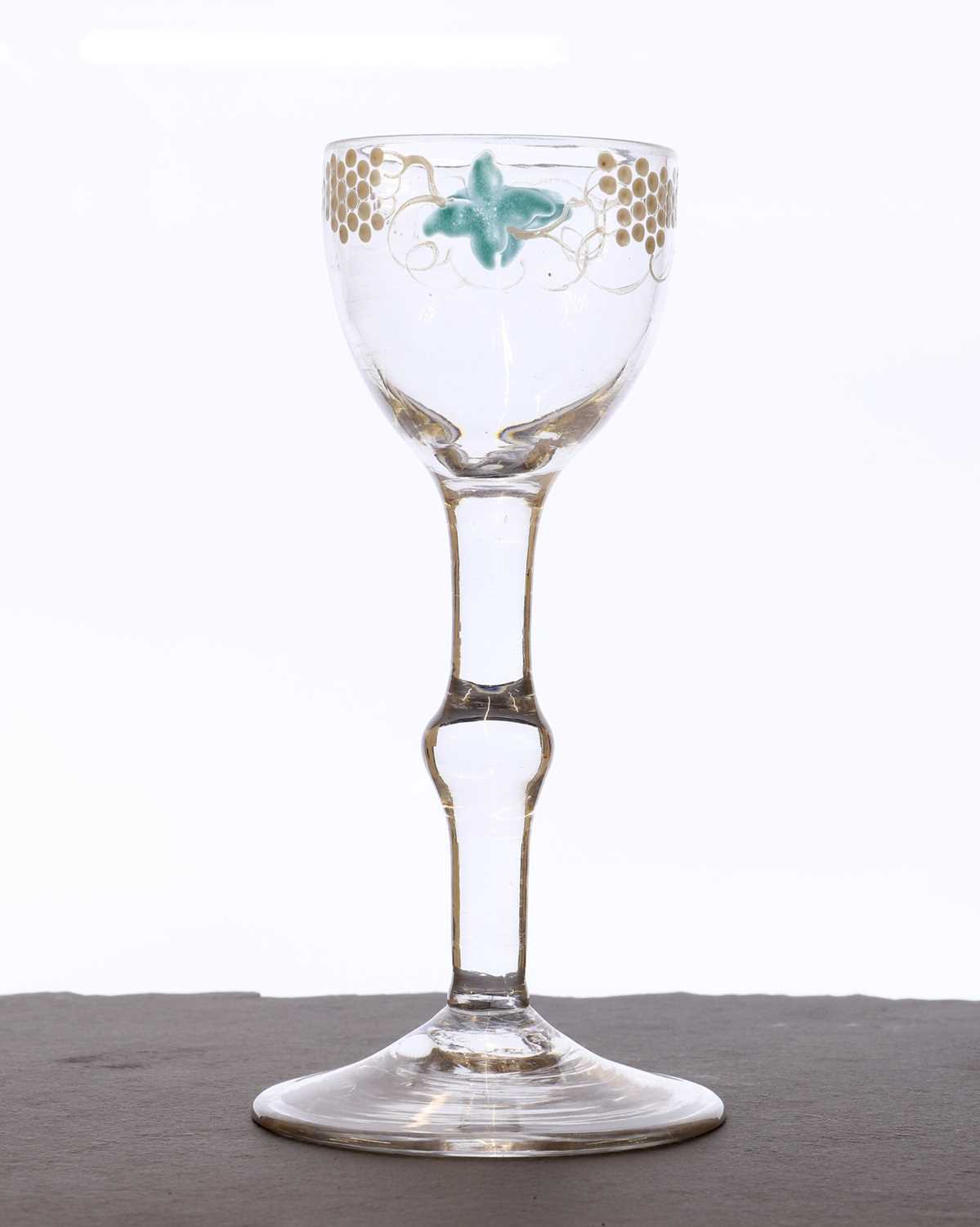 Lot 341 - A Beilby polychrome enamelled wine glass
