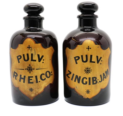 Lot 210 - A pair of amethyst glass apothecary bottles