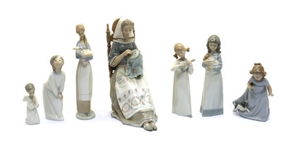 Lot 83A - A collection of seven Nao and Lladro figurines