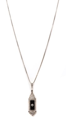 Lot 64 - A diamond and onyx pendant