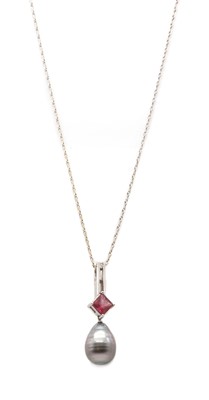 Lot 330 - A white gold cultured Tahitian pearl, tourmaline and diamond pendant, by Autore