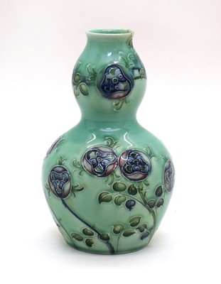 Lot 144 - A William Moorcroft for Liberty & Co. Florianware double gourd vase