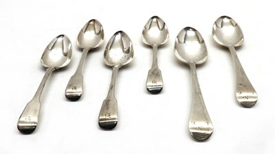 Lot 10 - A set of four George III silver Fiddle pattern dessert spoons
