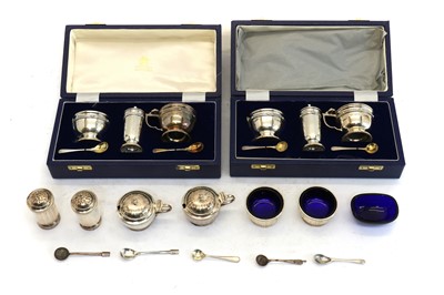 Lot 54 - A pair of silver cruet sets