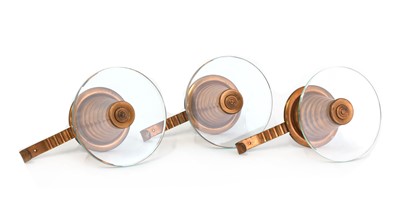 Lot 470 - A set of three Italian, modernist, copper and glass coat hangers