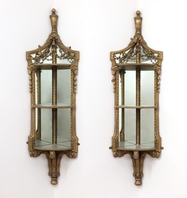 Lot 311 - A pair of giltwood encoigneur
