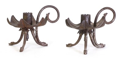 Lot 43 - A pair of unusual iron chambersticks