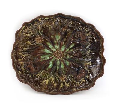 Lot 5 - A Linthorpe mottled majolica lily-pad-shaped dish