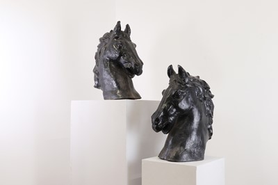 Lot 383 - A pair of cast iron horses' heads