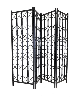 Lot 192 - A four-fold ebonised canework screen