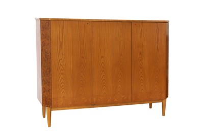 Lot 240 - A Swedish three-door ash veneered side cabinet