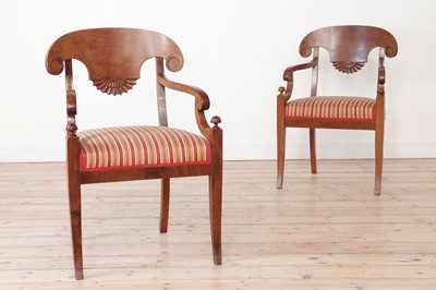 Lot 409 - A pair of Biedermeier-style stained birch elbow chairs