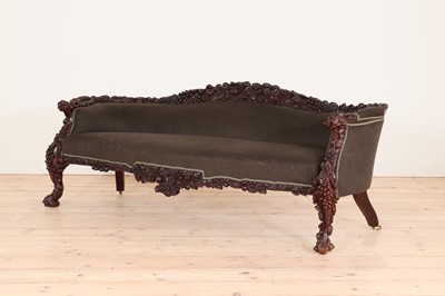 Lot 387 - A carved rosewood settee