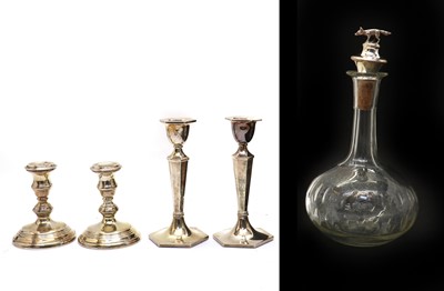 Lot 34 - A pair of silver candlesticks