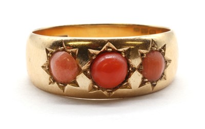 Lot 22 - A gold three stone cabochon ring