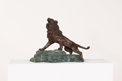 Lot 269A - An Art Deco style bronze figure of a lion