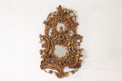 Lot 310 - A profusely carved giltwood and gesso girandole