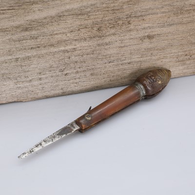 Lot 33 - An unusual pressed horn figural pocket knife