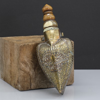 Lot 173 - An Ottoman brass-mounted heart-shaped wooden powder flask