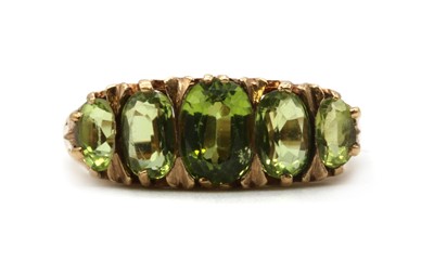 Lot 226 - A 9ct gold five stone peridot ring