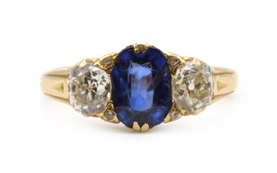 Lot 13 - A gold sapphire and diamond three stone ring