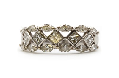 Lot 154 - A white gold three row diamond ring