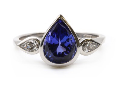 Lot 289 - An 18ct white gold tanzanite and diamond three stone ring